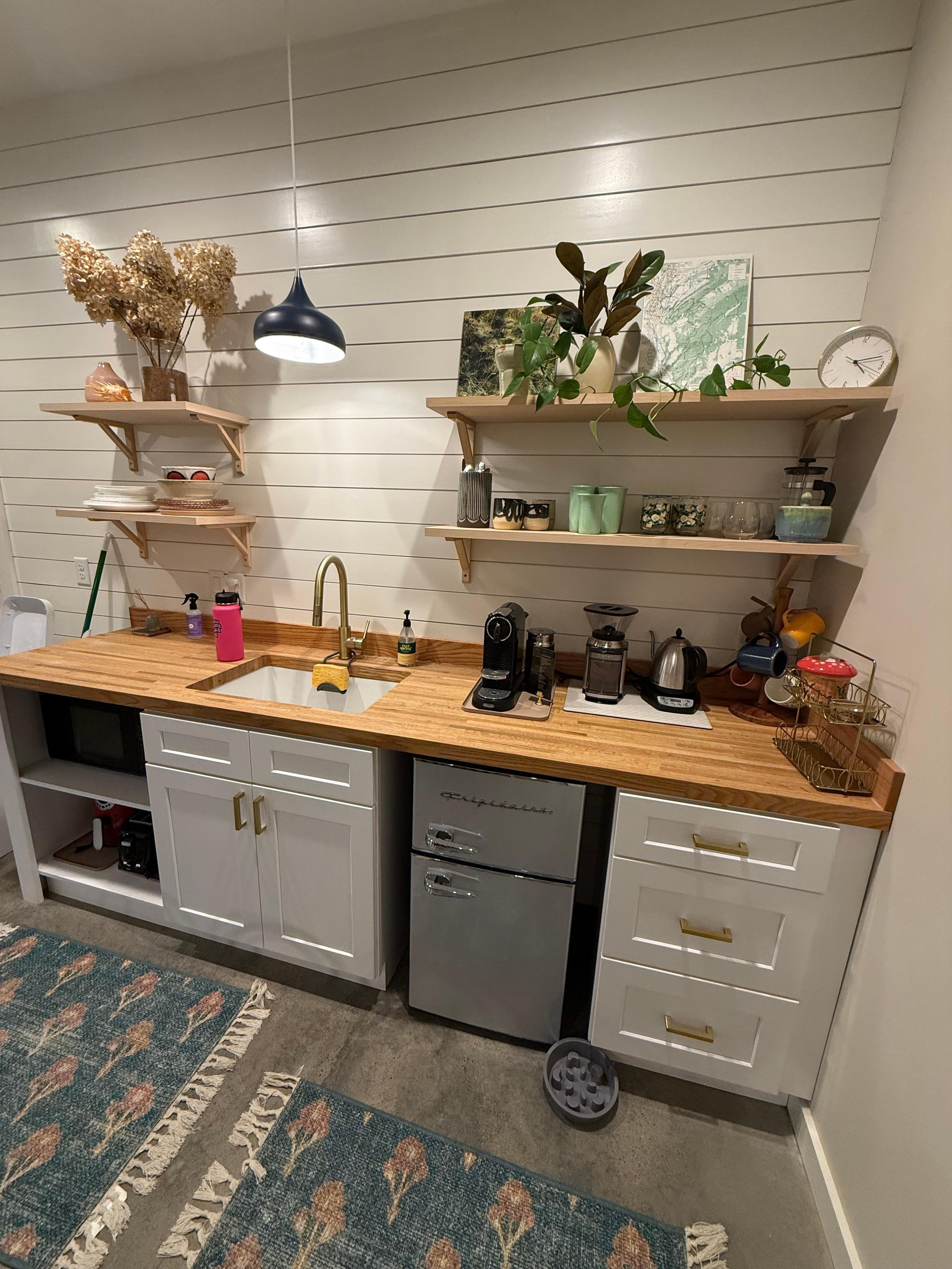 Adorable kitchenette area fully stocked. 