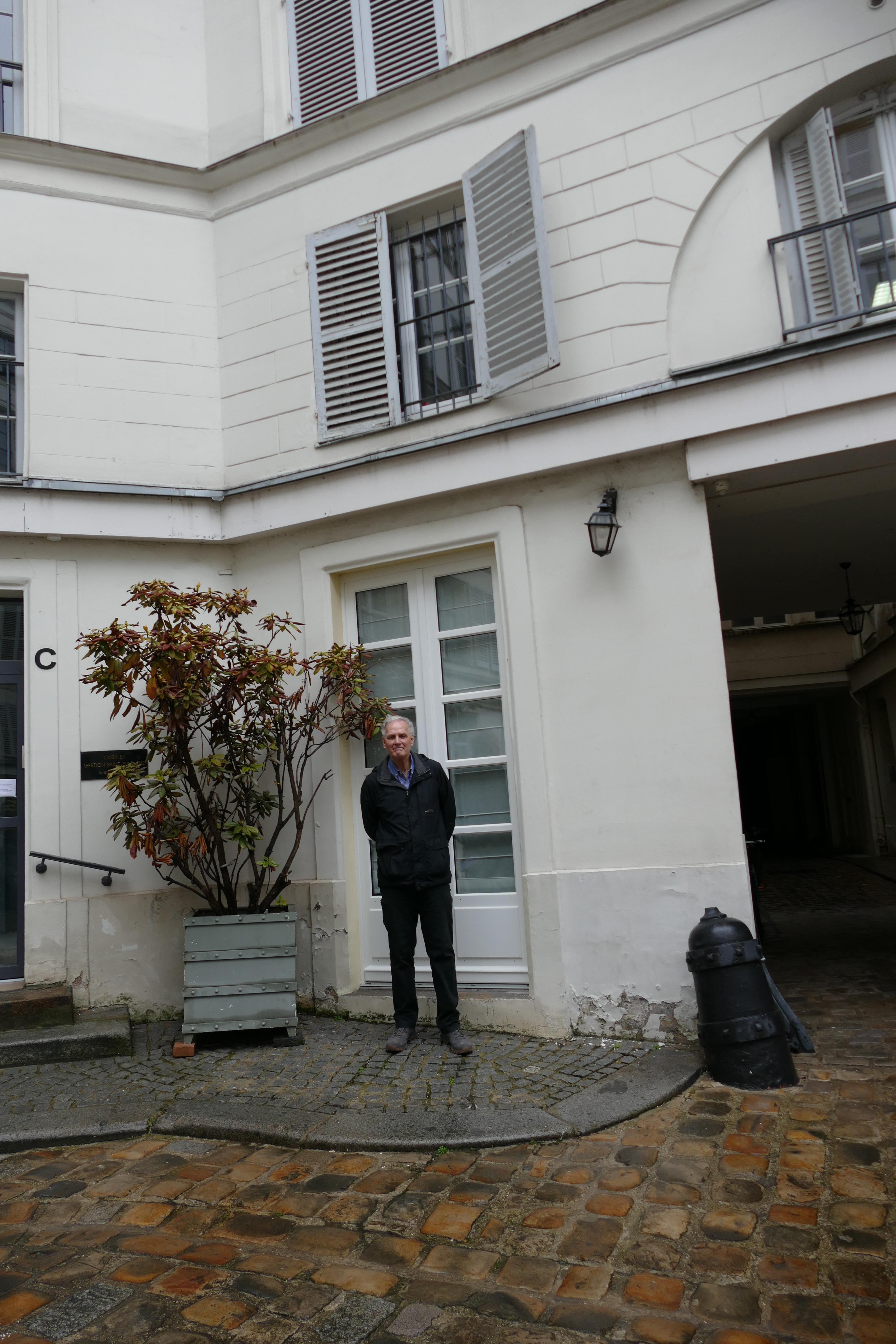 Ground Level, but with a high step to get into the suite.  Note the two narrow glass doors, that a wheel chair or walker could never get through.