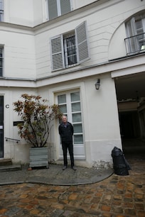Ground Level, but with a high step to get into the suite. Note the two narrow glass doors, that a wheel chair or walker could never get through.