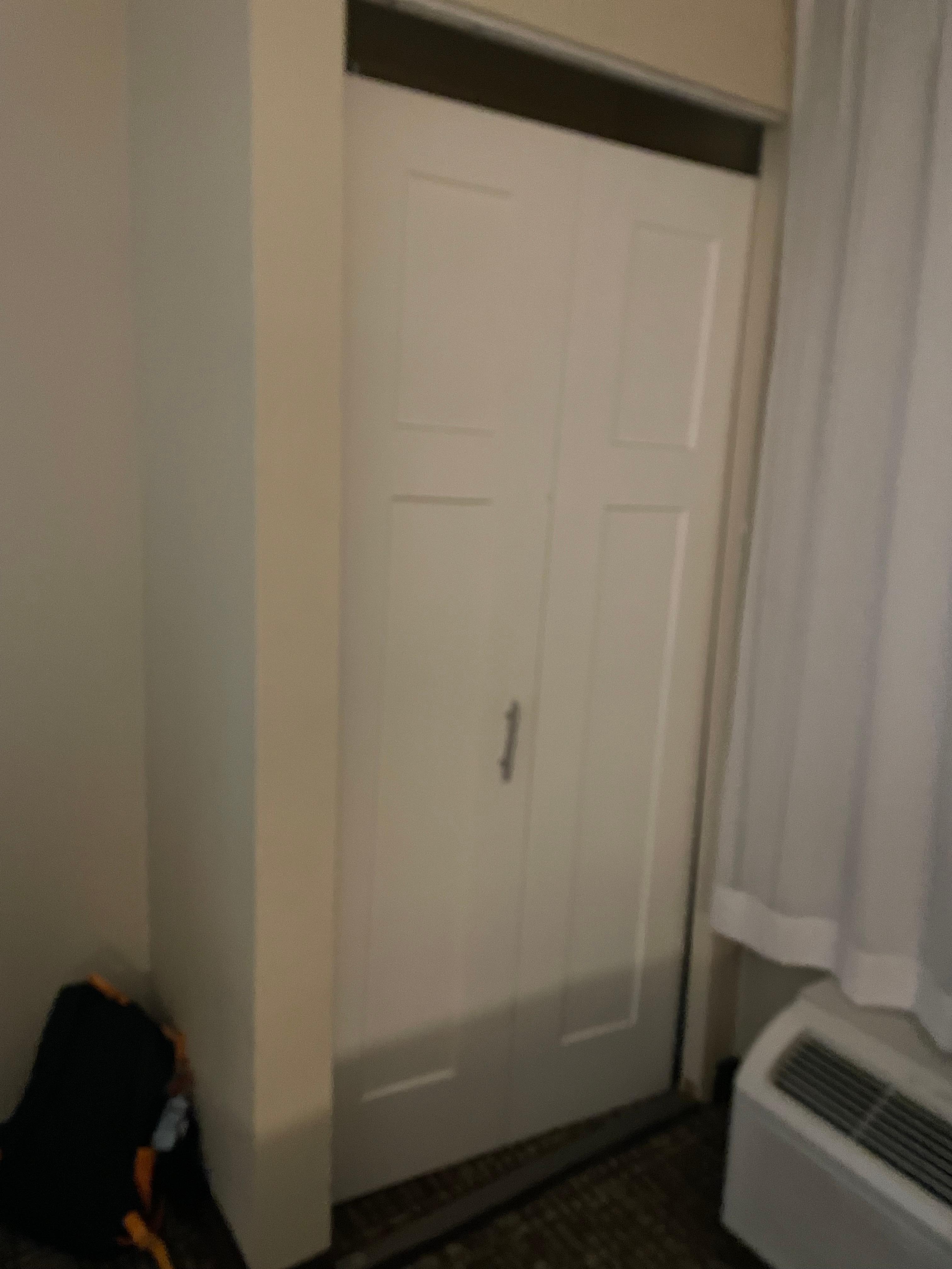 Closet door not attached, just propped there