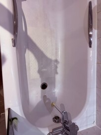 bathtub is old and dirty. The shower leaks and the drain does not drain.