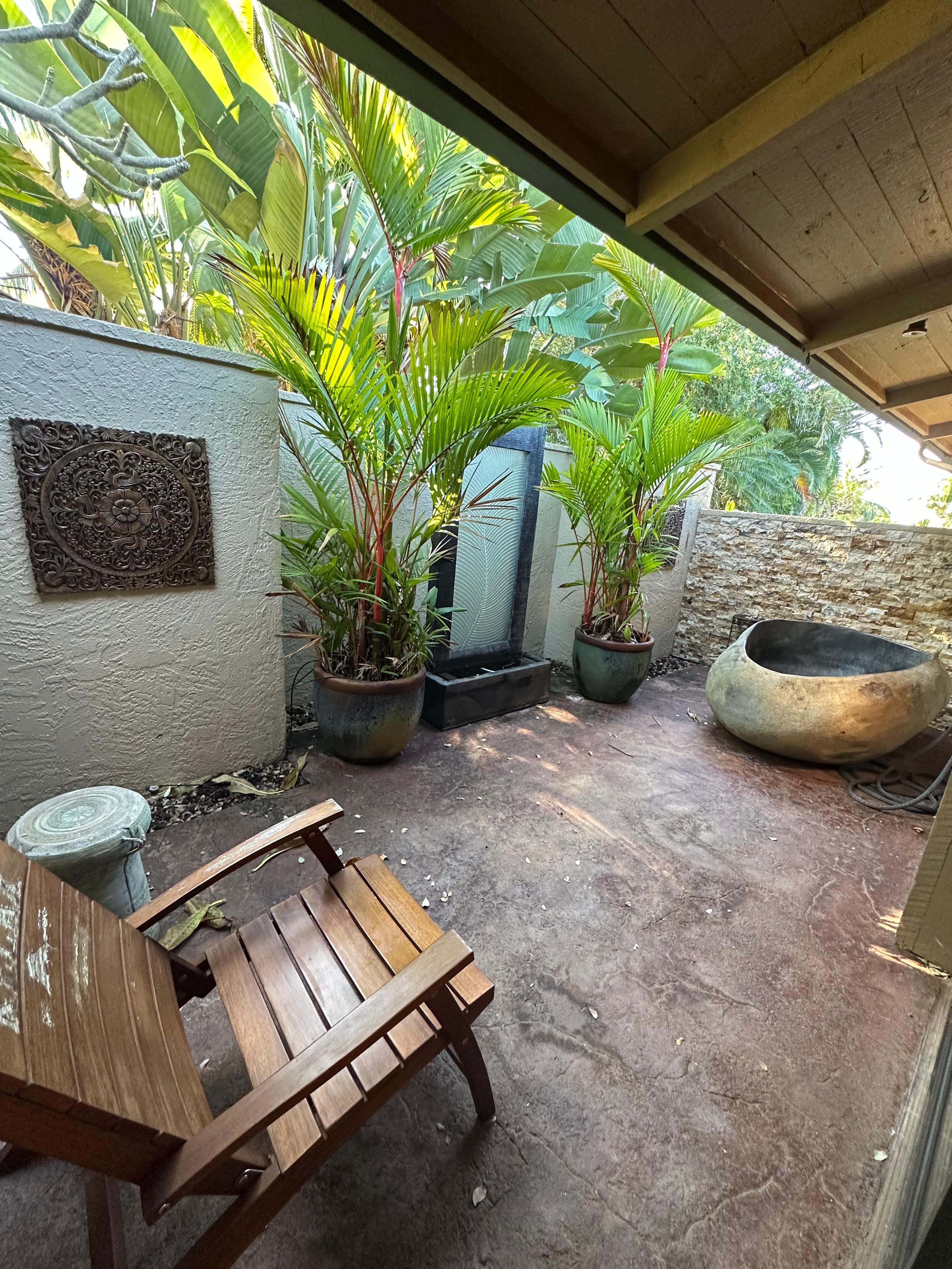 Private primary outdoor zen rock tub patio