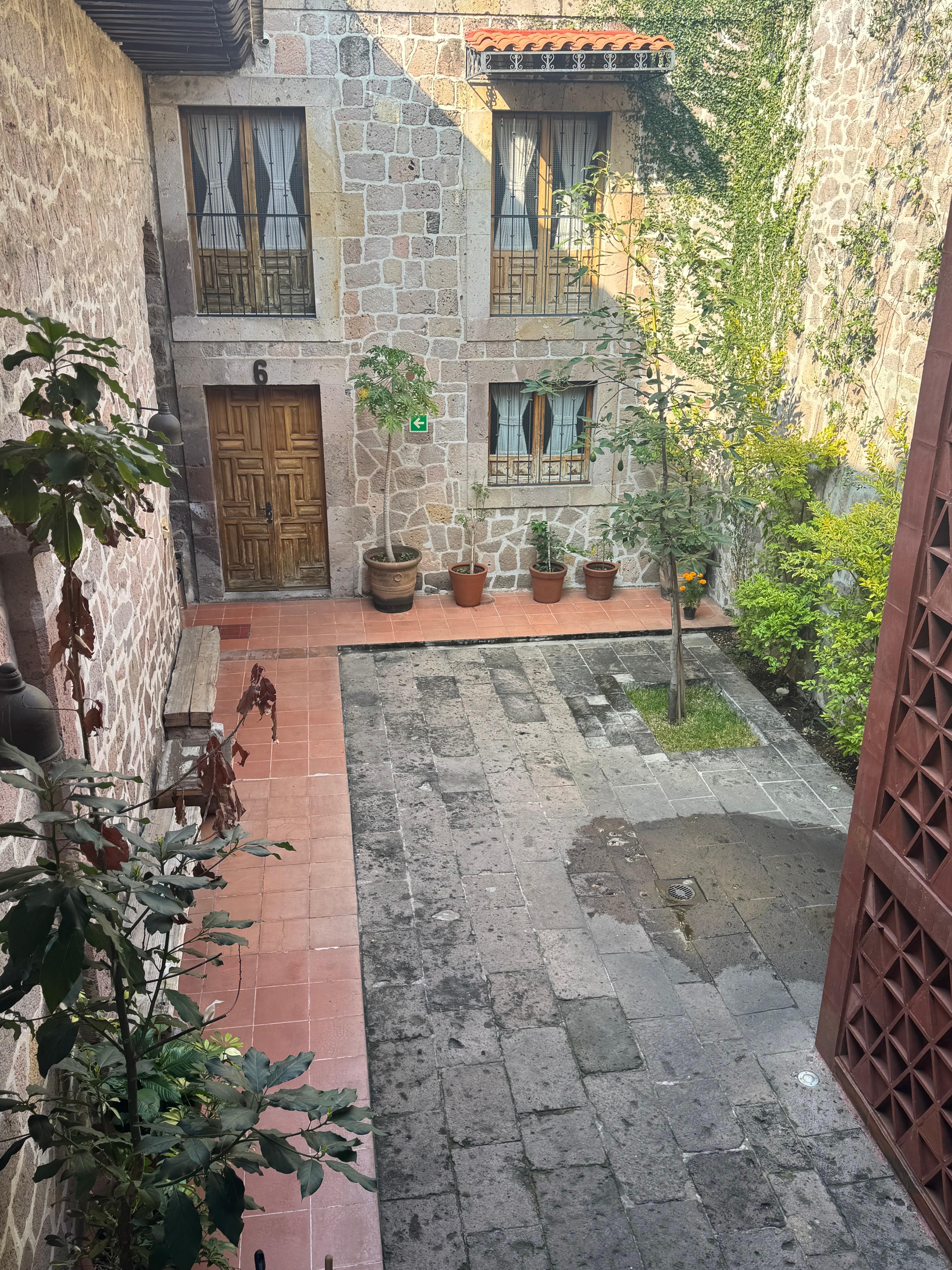 Courtyard towards the back of the hotel during the day. 
