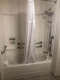 Not walk in, not even shower chair.