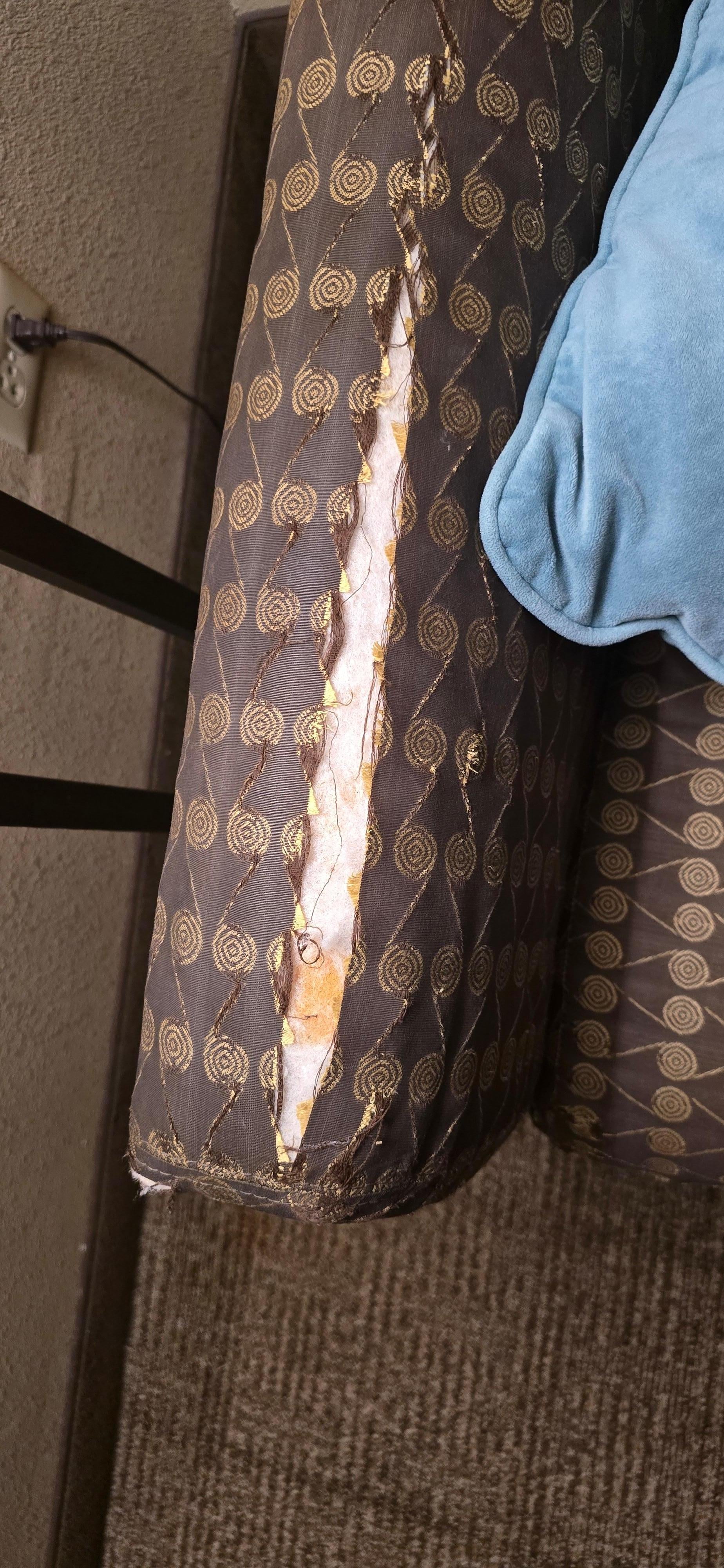 Arm of pull out sofa bed.