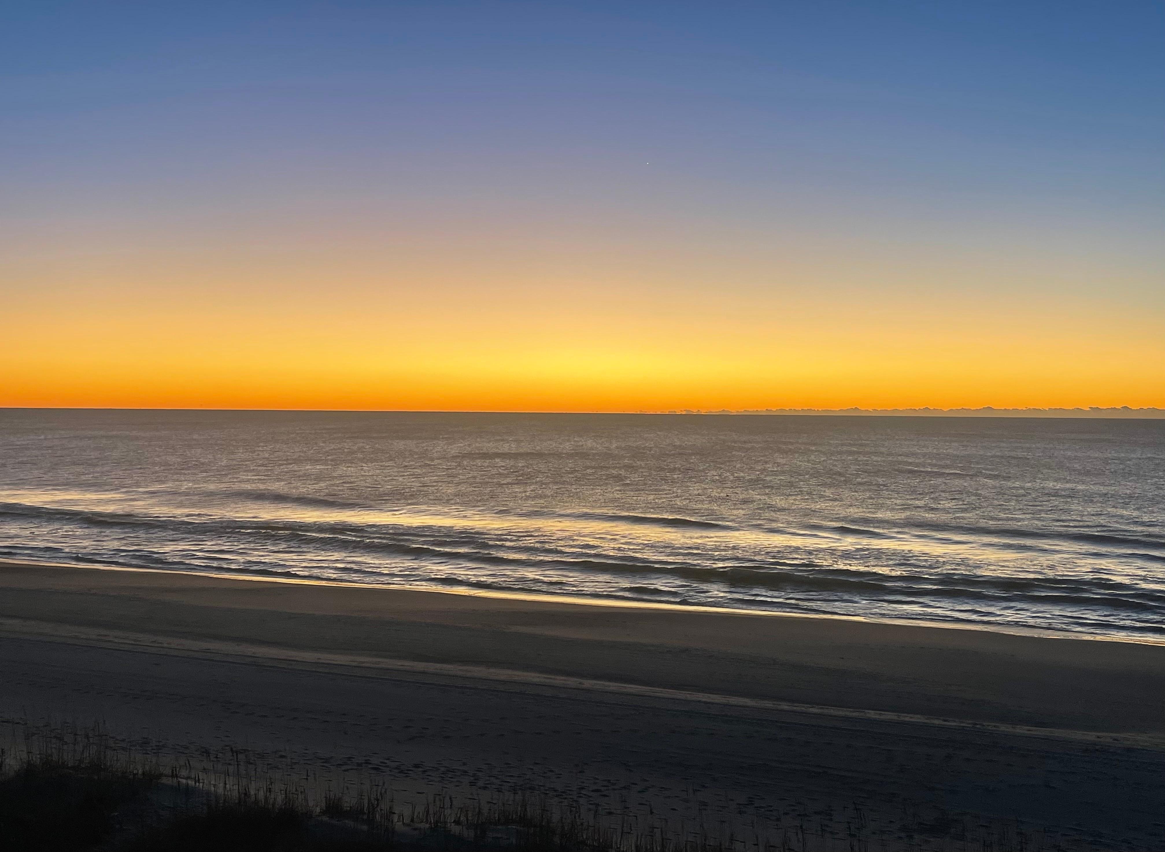 Beautiful sunrise from the porch overlooking the beach.