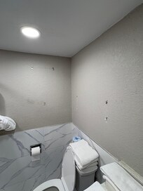 Holes in walls of bathroom