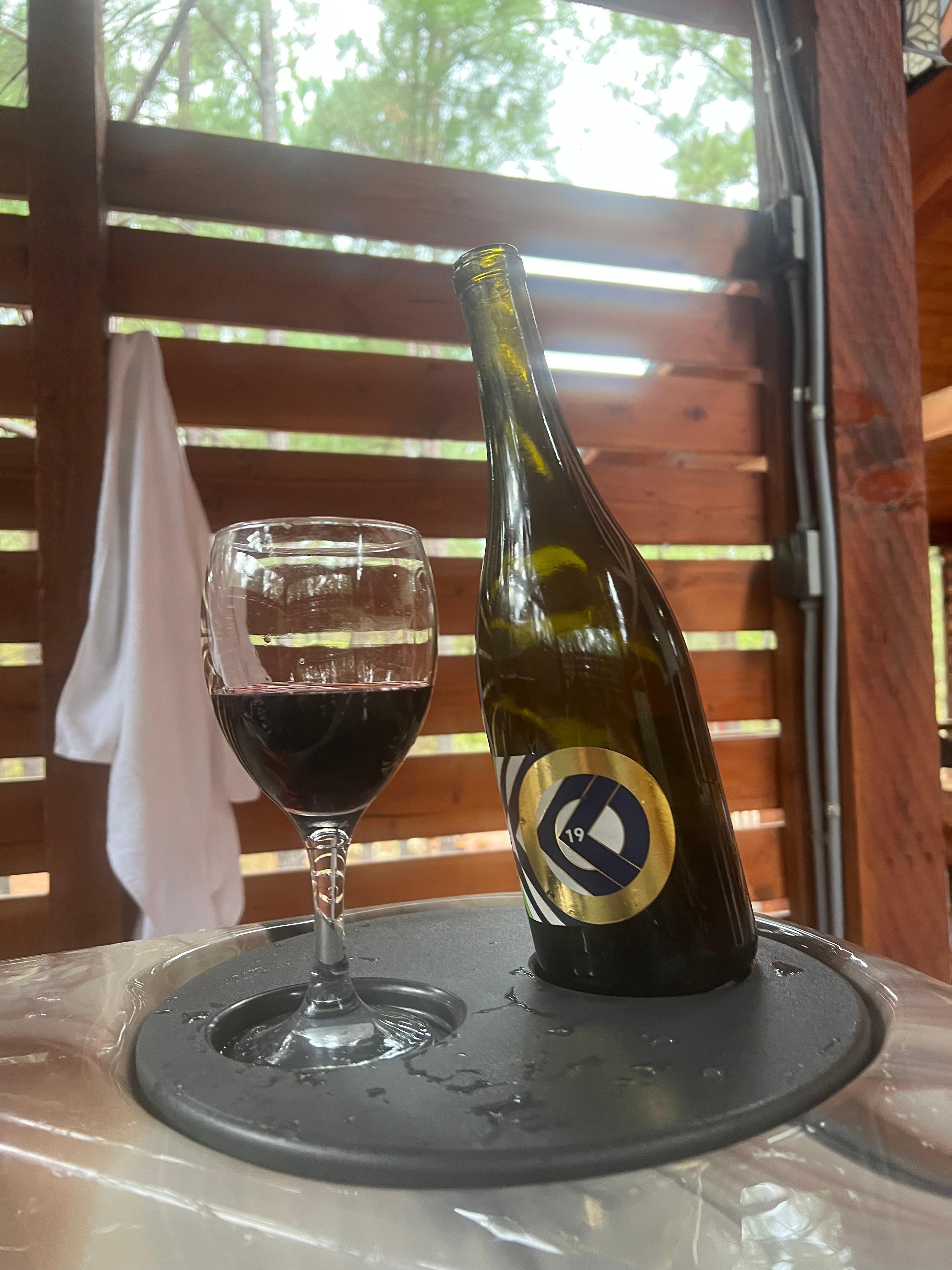 Hot tub area includes spaces for wine glasses & bottles of great Texas wine