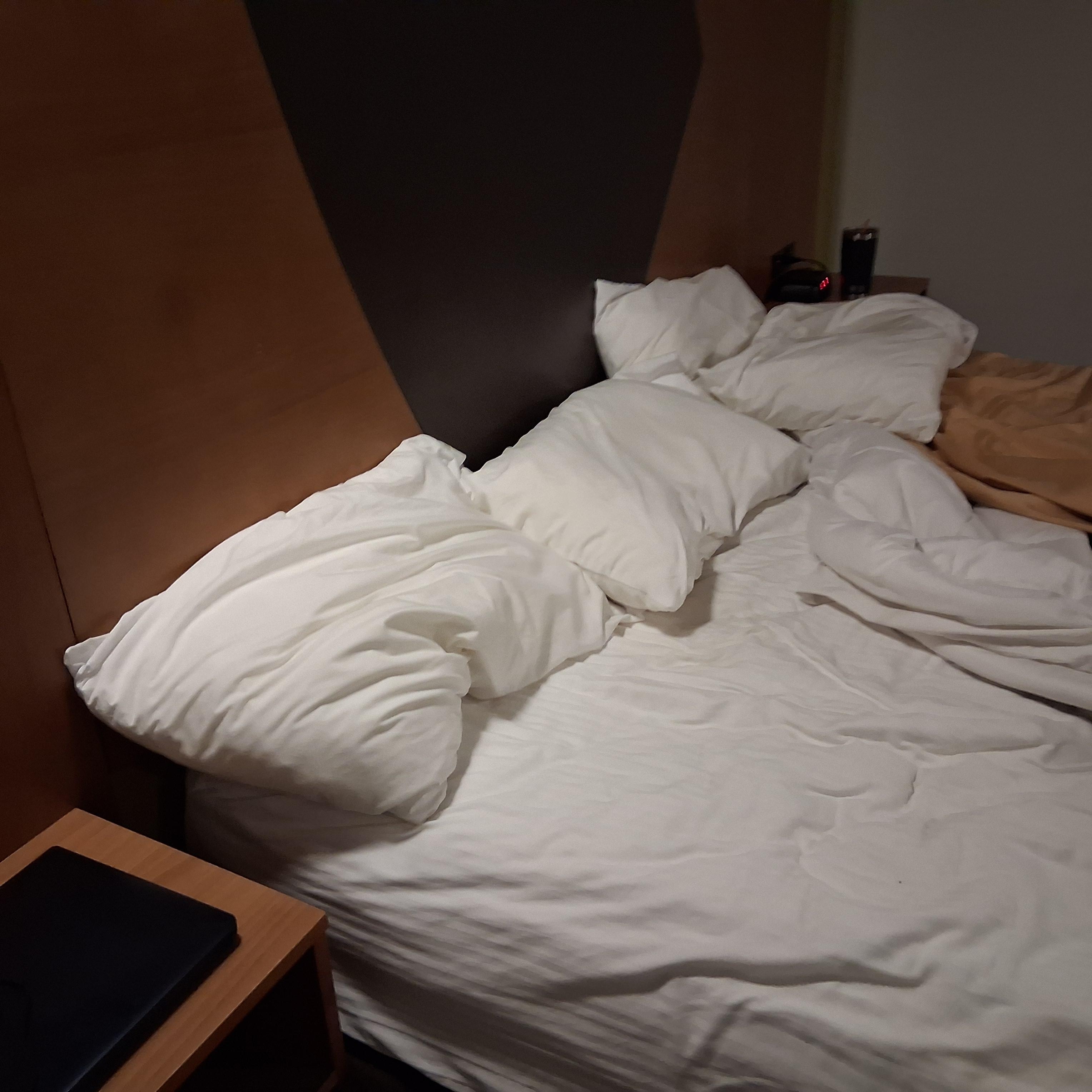 Regular size pillows on king size bed.