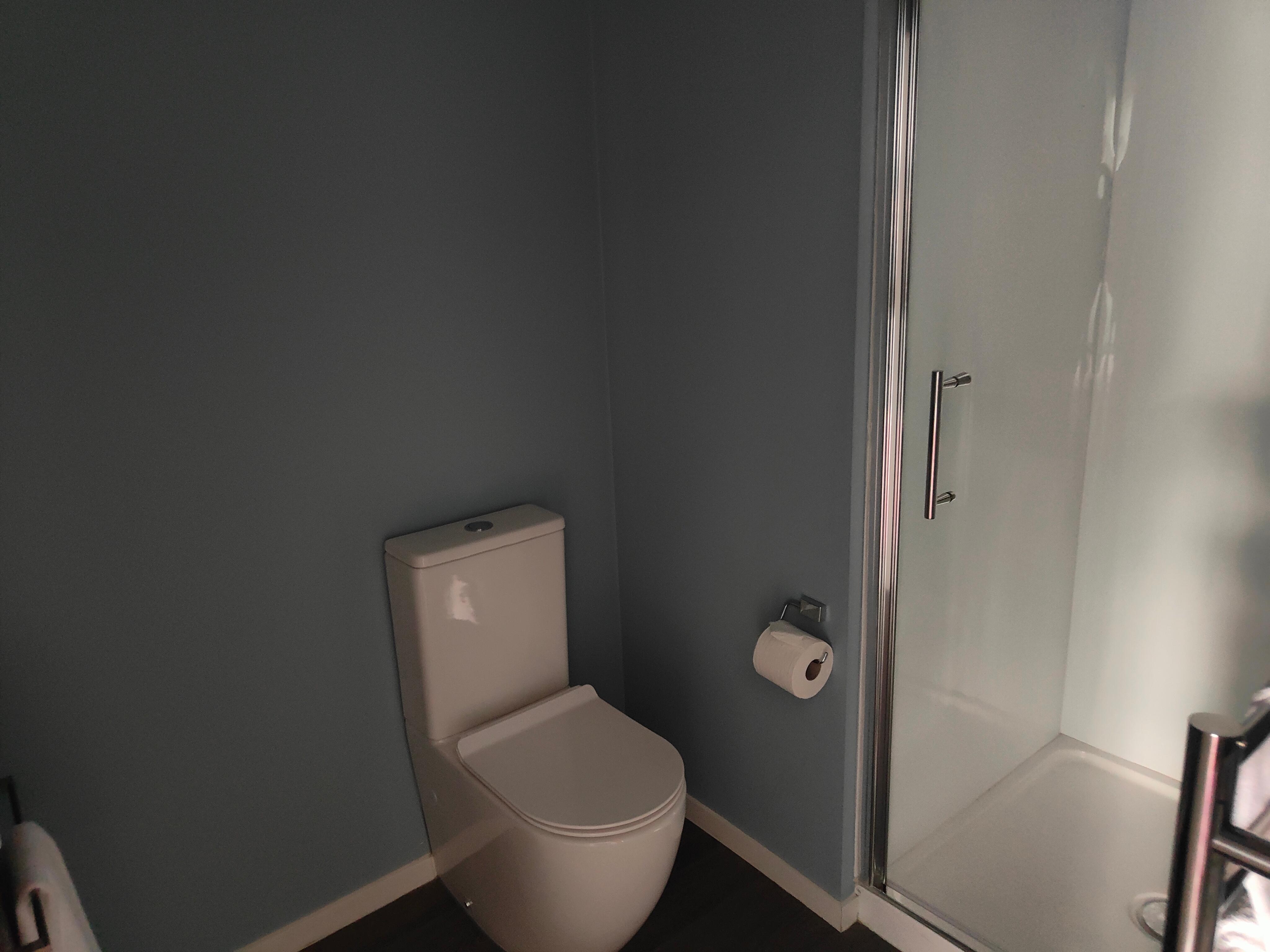 Bathroom that had a large washer and dryer also