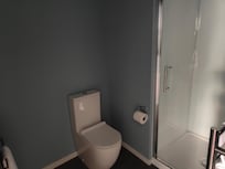 Bathroom that had a large washer and dryer also