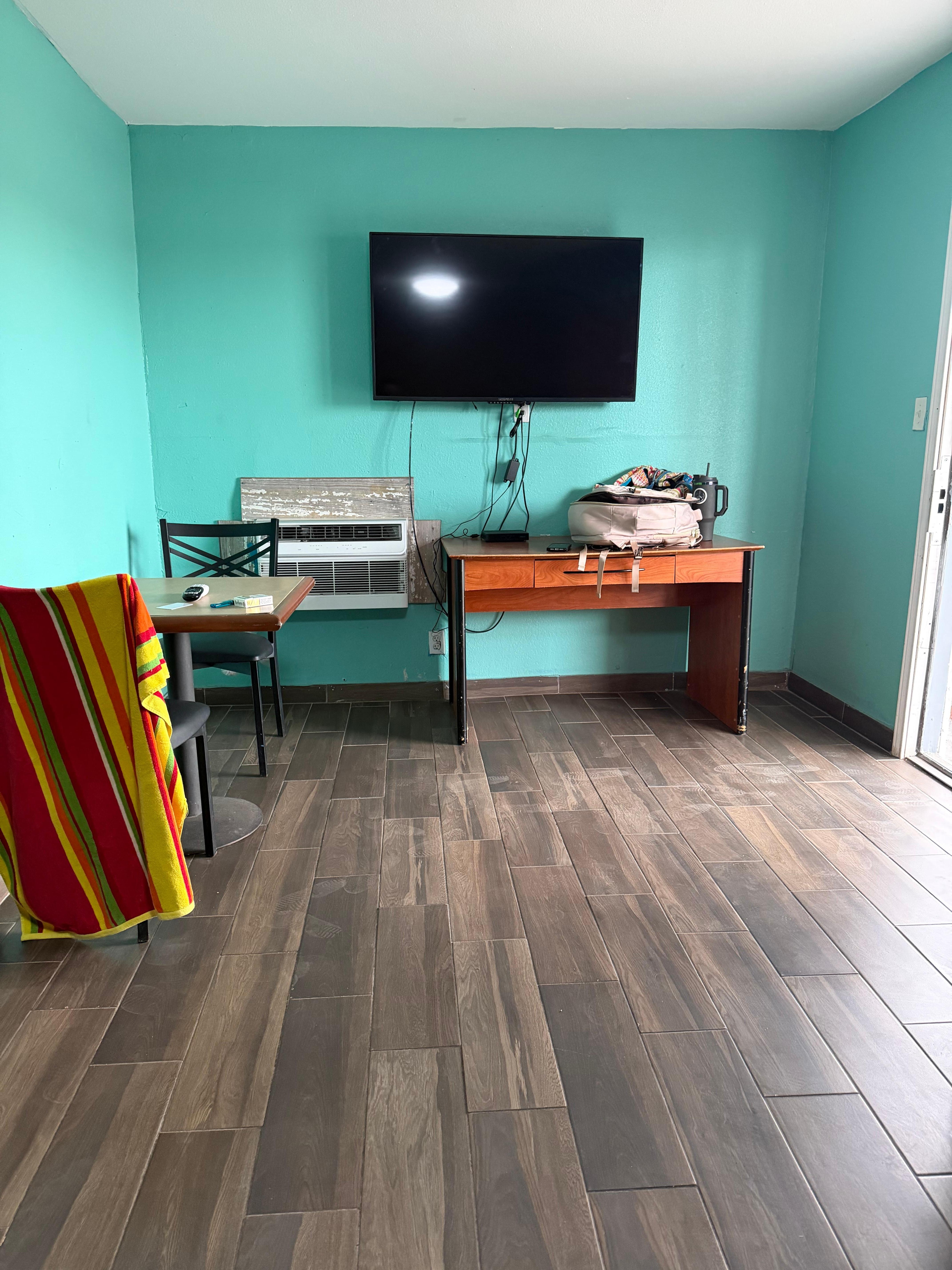 Foot of bed, left is bathroom, kitchen area. 