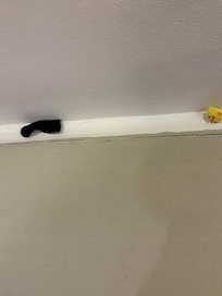 A child’s wind up chicken behind the couch cushion