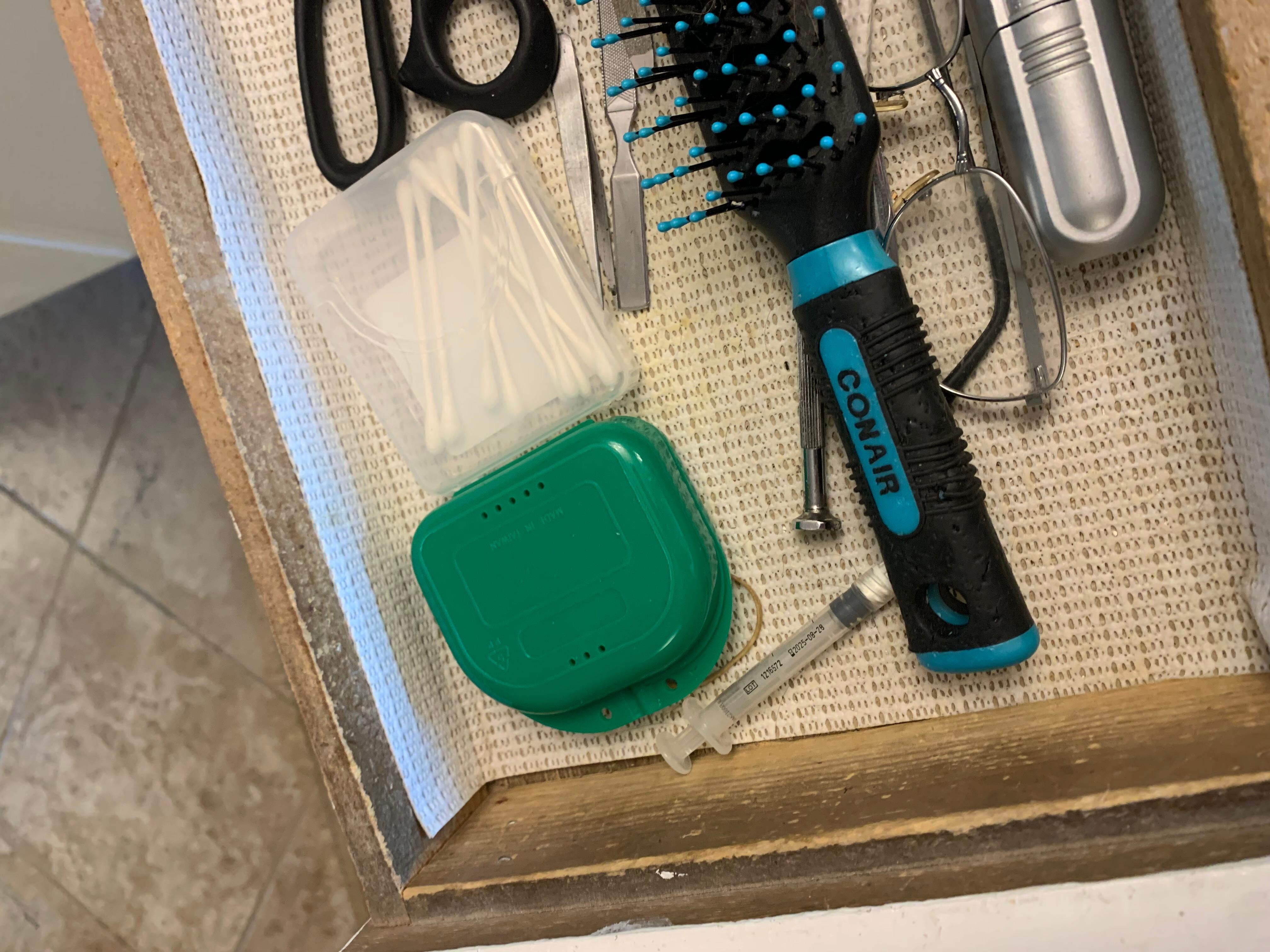 Syringe in next drawer up, both drawers in toddler and crawling infants reach