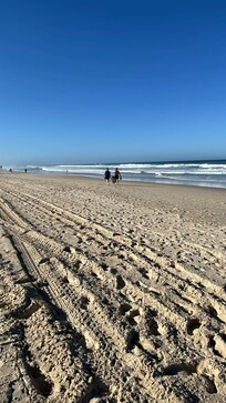 Walking along the beach with our granbaby🥰