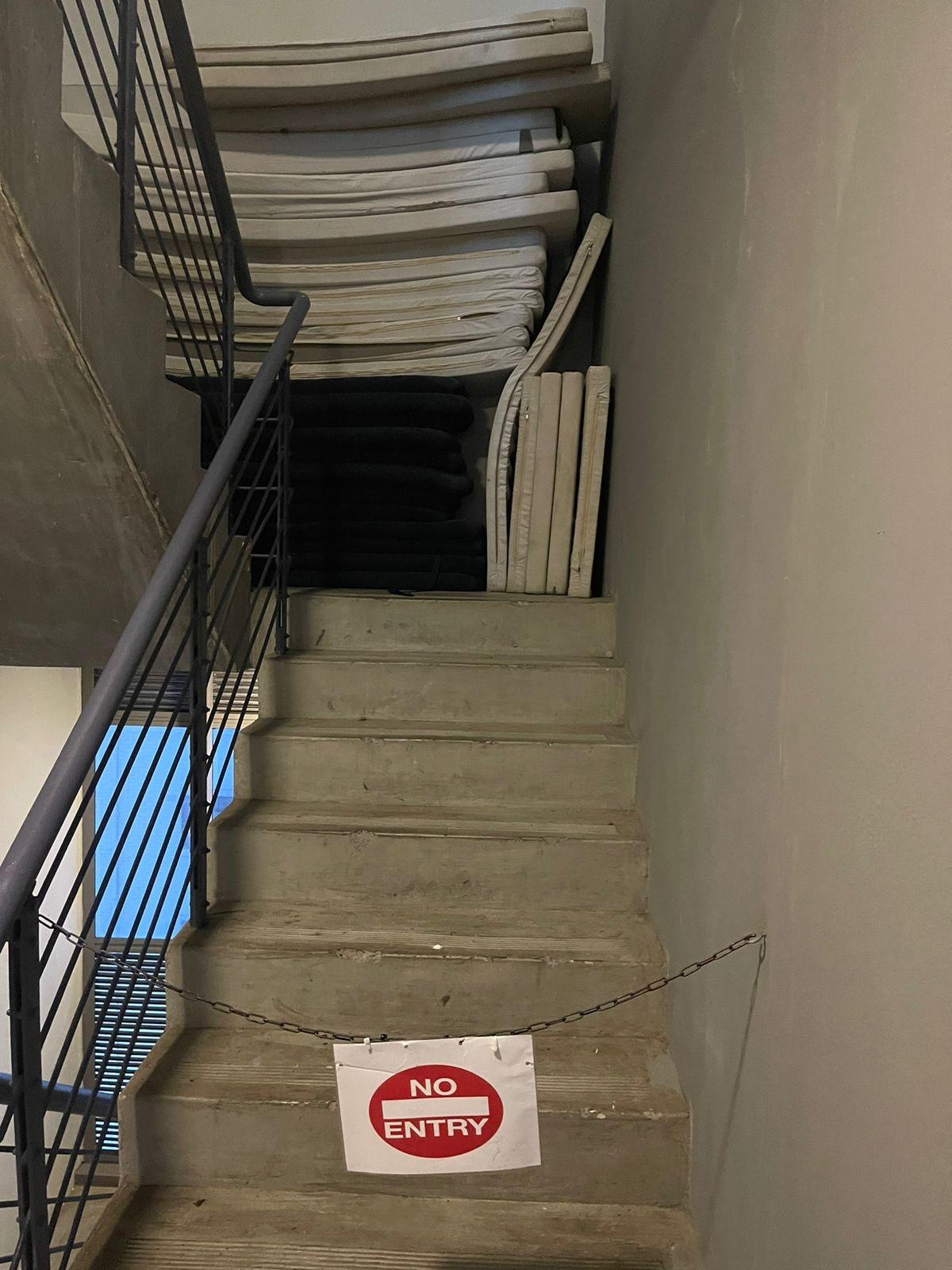 Cushions and chain blocking stairs