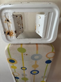 Rusty stained ironing board