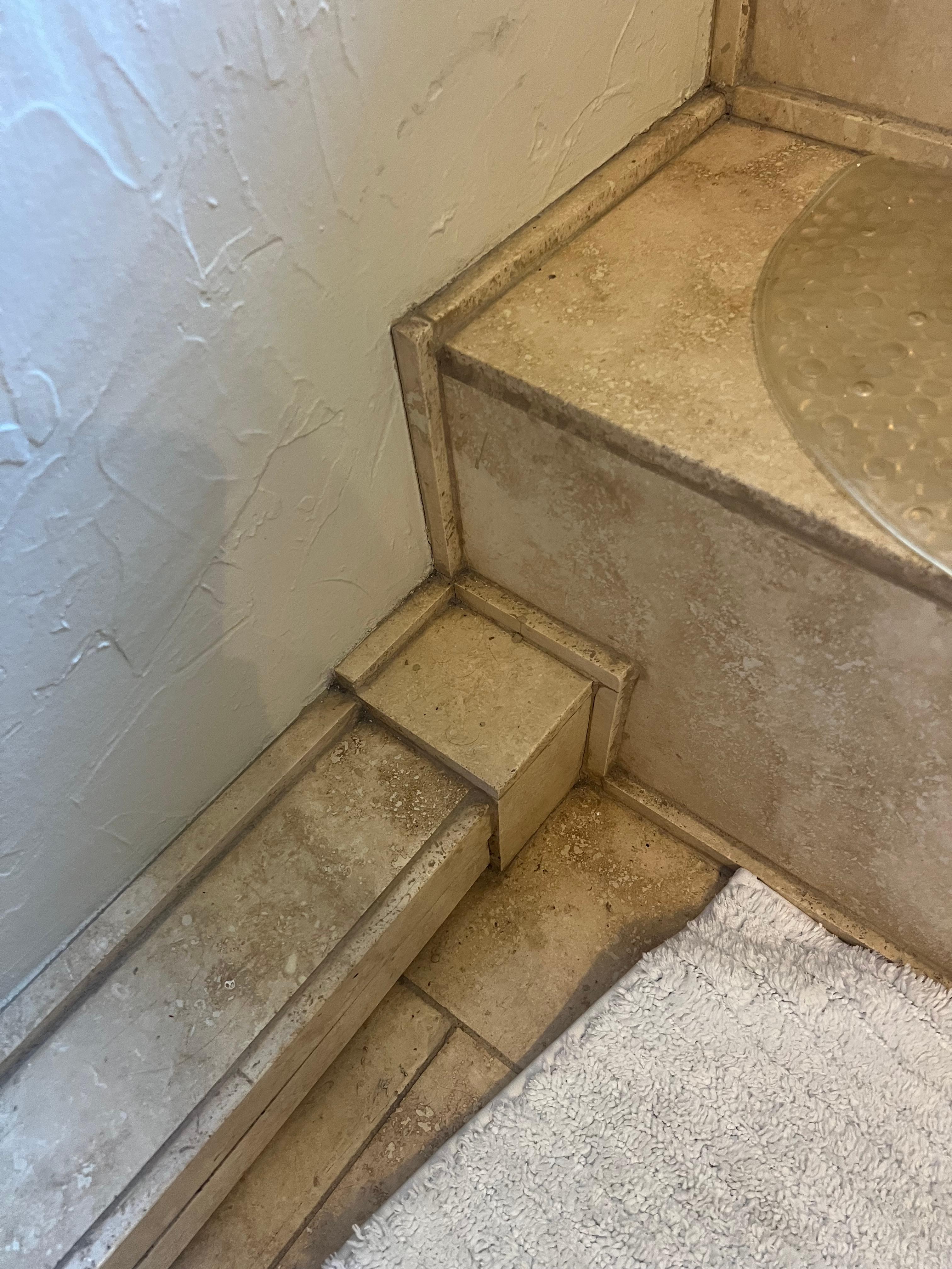Filthy floors and tile in bathroom
