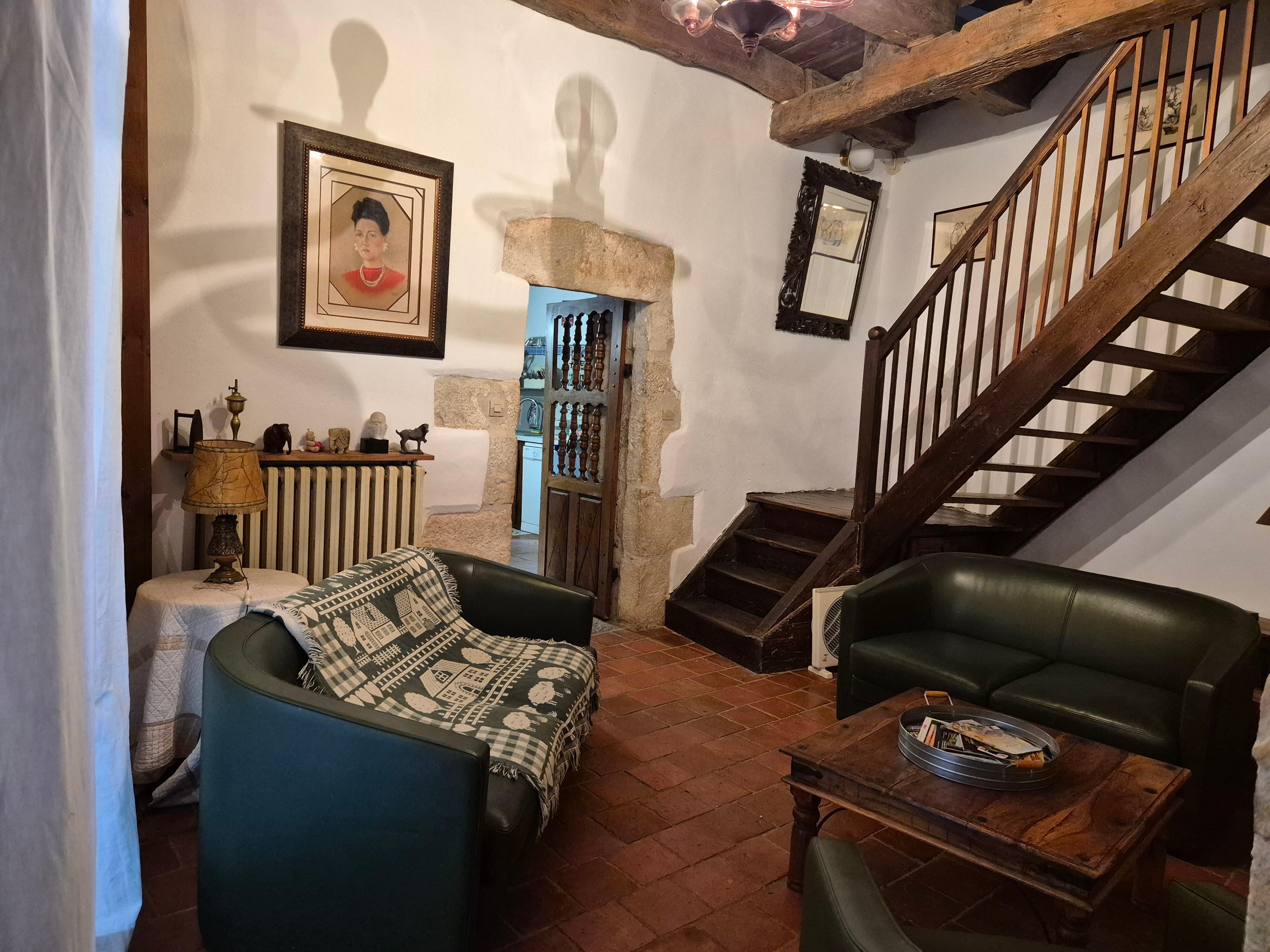 Dark living area with only 5 comfy seats
