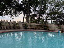 View of golf course beyond the pool.