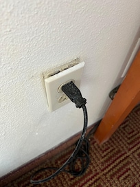 Broken outlet cover, unsafe for children
