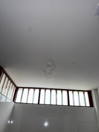 Broke window and ceiling stains