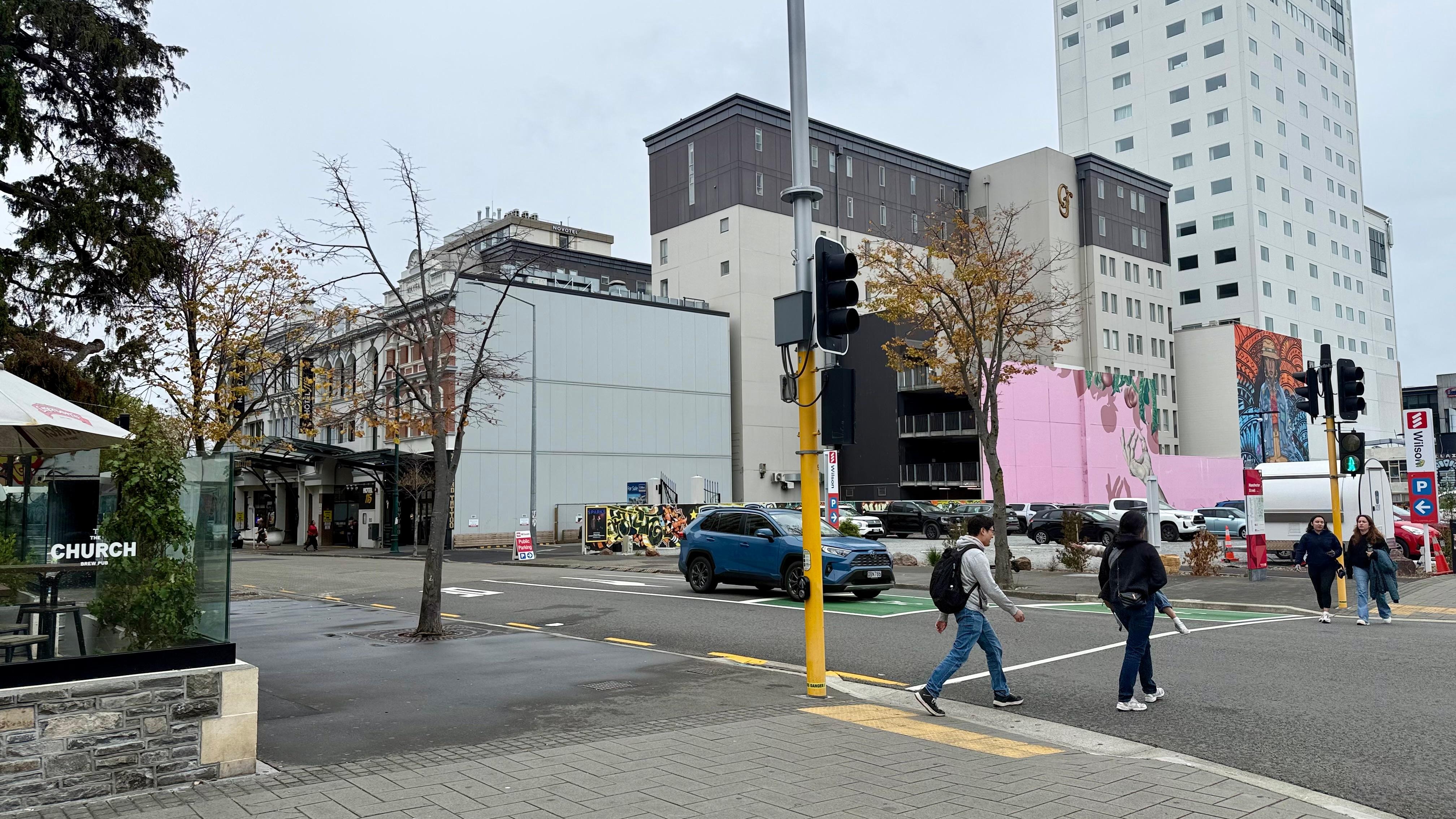 Hotel is where the pink wall is. Bus stop is in front of The Church and Paddy’s pub
