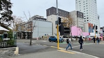 Hotel is where the pink wall is. Bus stop is in front of The Church and Paddy’s pub