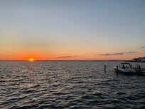 We walked two houses away to enjoy beautiful sunsets at the bay.