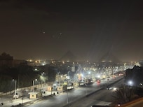Pyramids from the hotel. Dusty night.