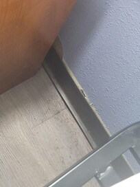 Floor behind one bed