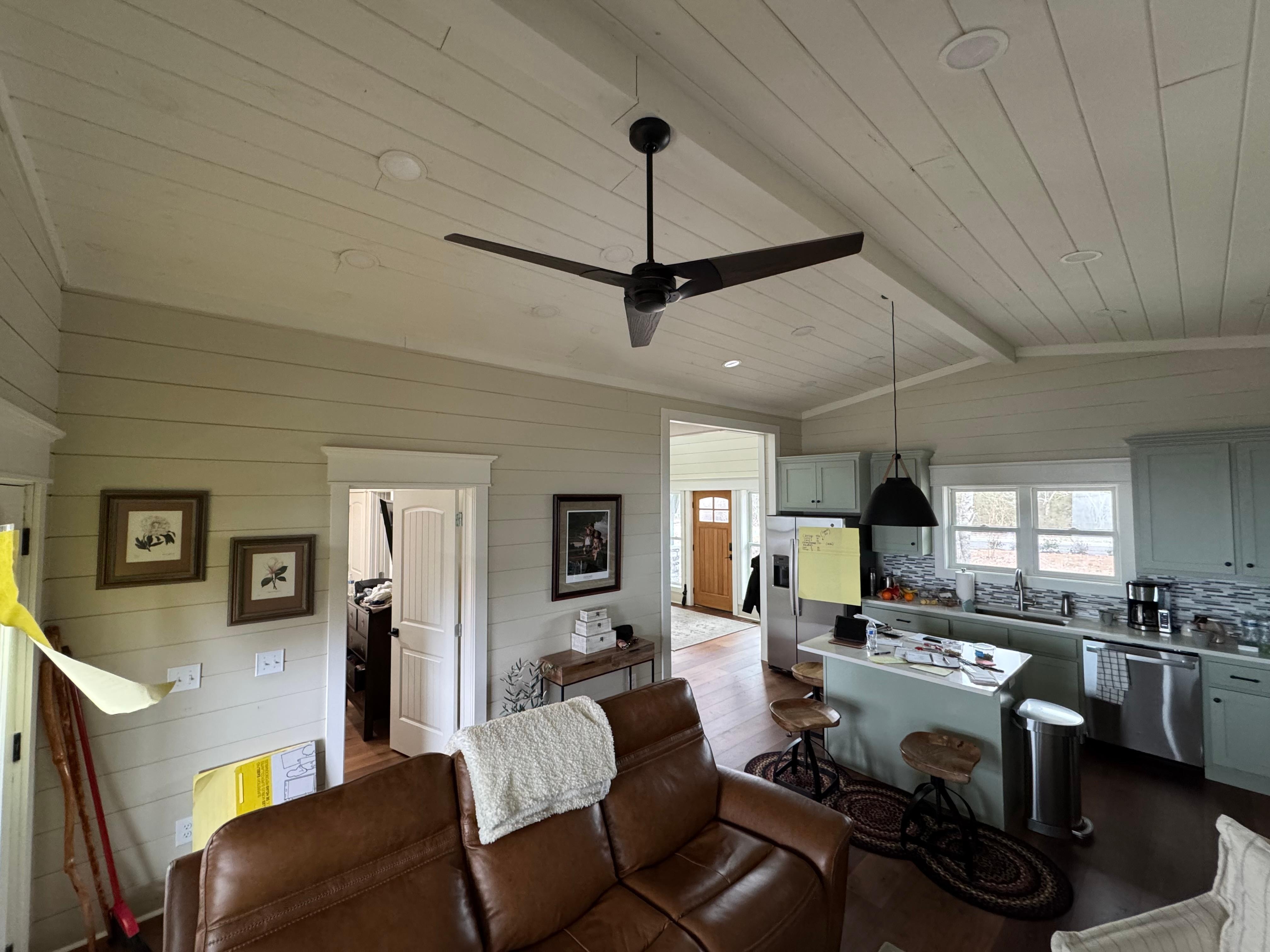 From the living room towards the front entryway. Kitchen and downstairs bedroom entrance 