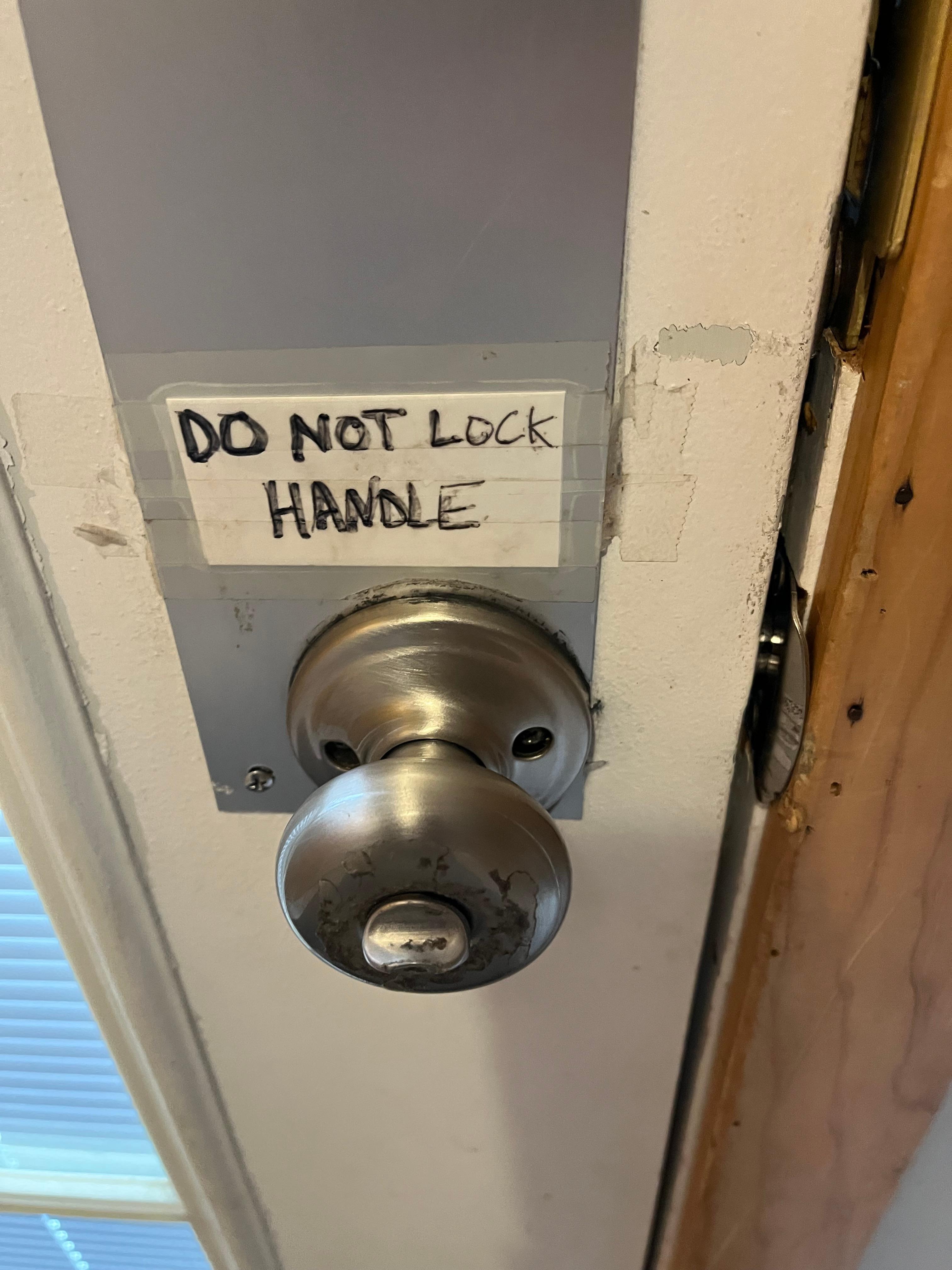 Door lock on knob is broke and instead of replacing it they put a note on it saying not to use it