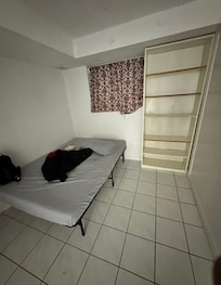 The mattress was hard. The bed had only a bed sheet with this old comforter.