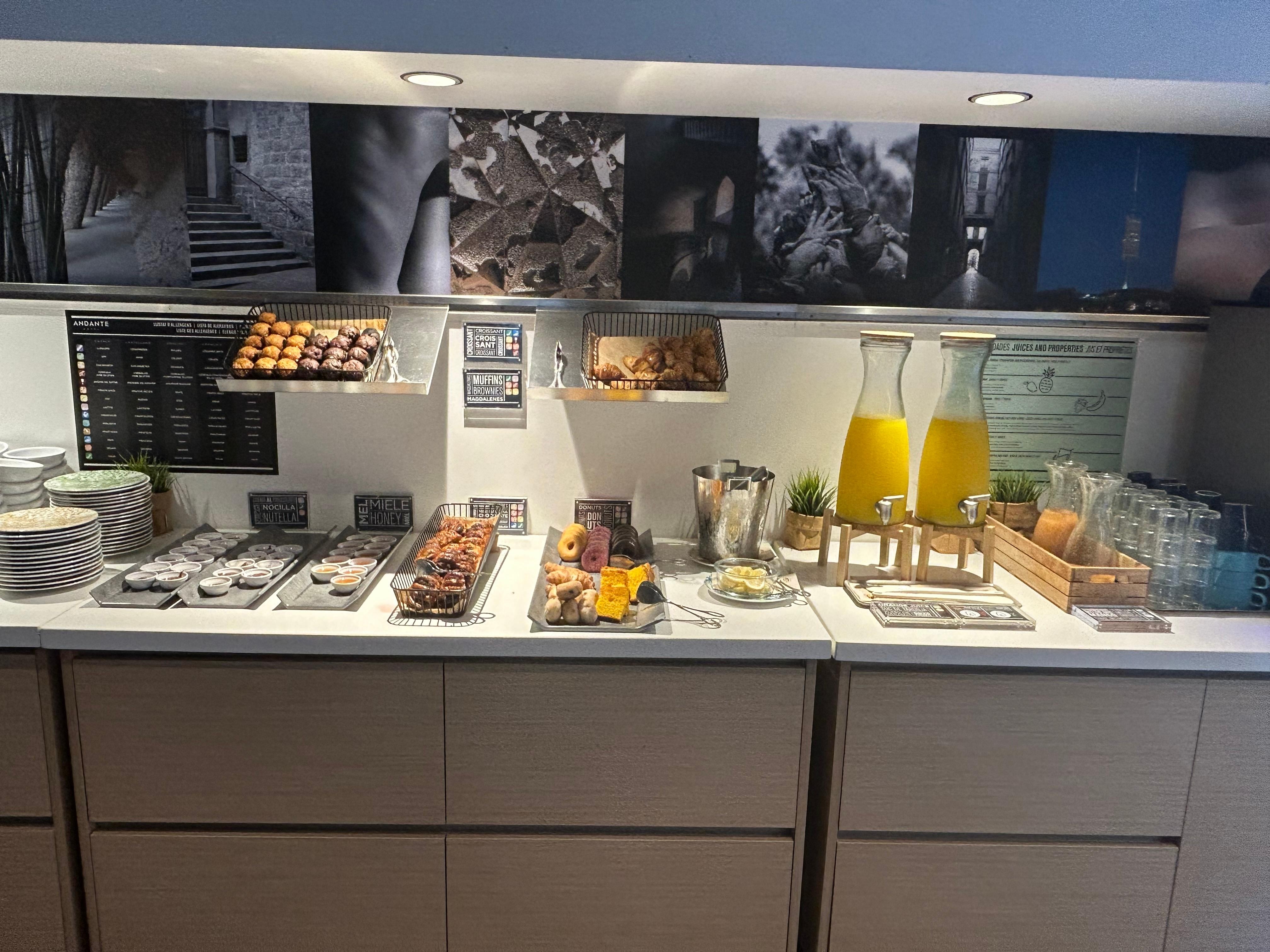 Pastries, cereal and juices at breakfast