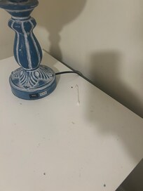 Dirty night stand and Q tip left by previous guest