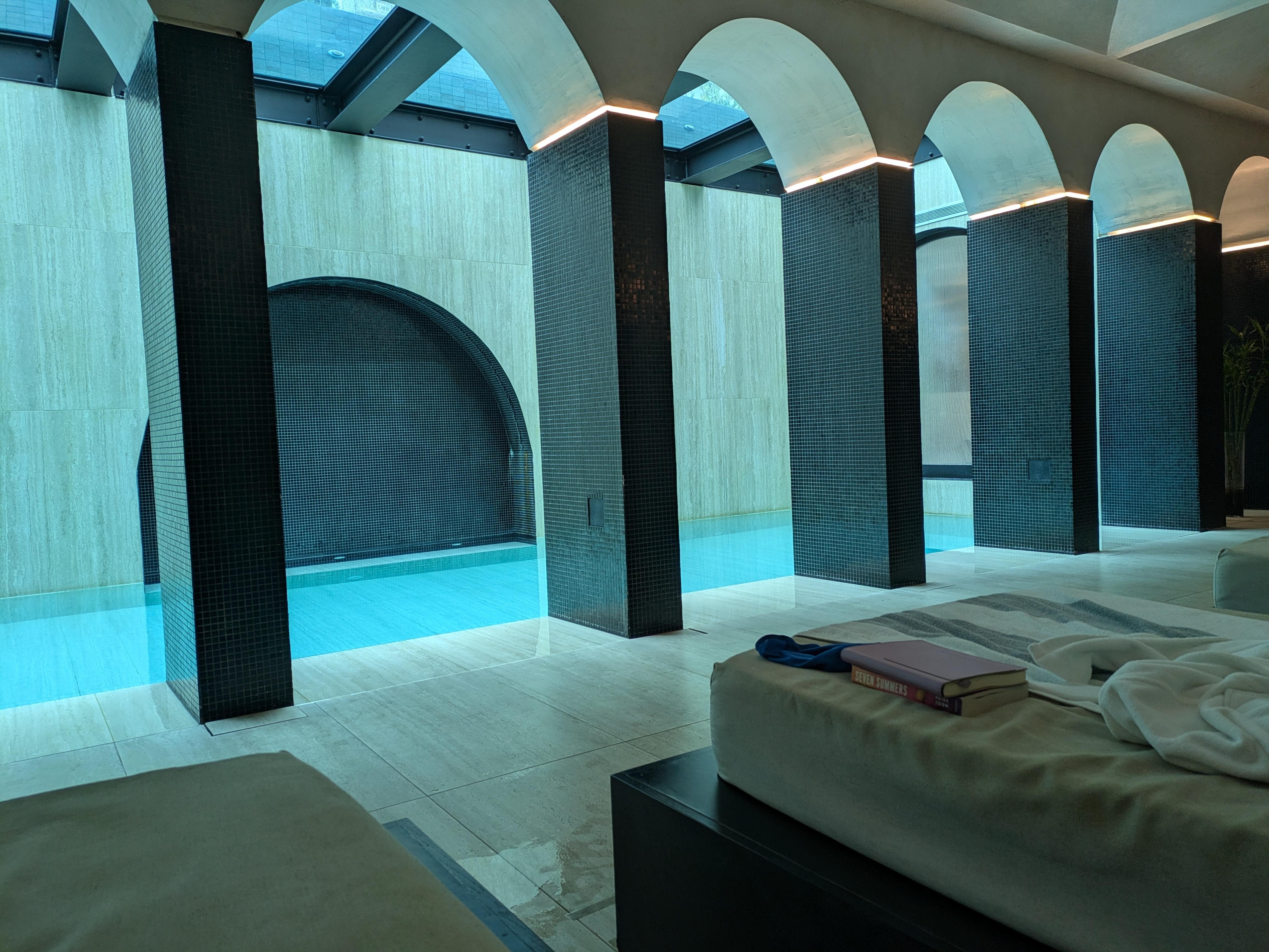 Glass-botton pool outside creates the ceiling of the spa pool inside (!).