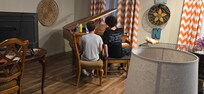 The kid's playing on the piano.