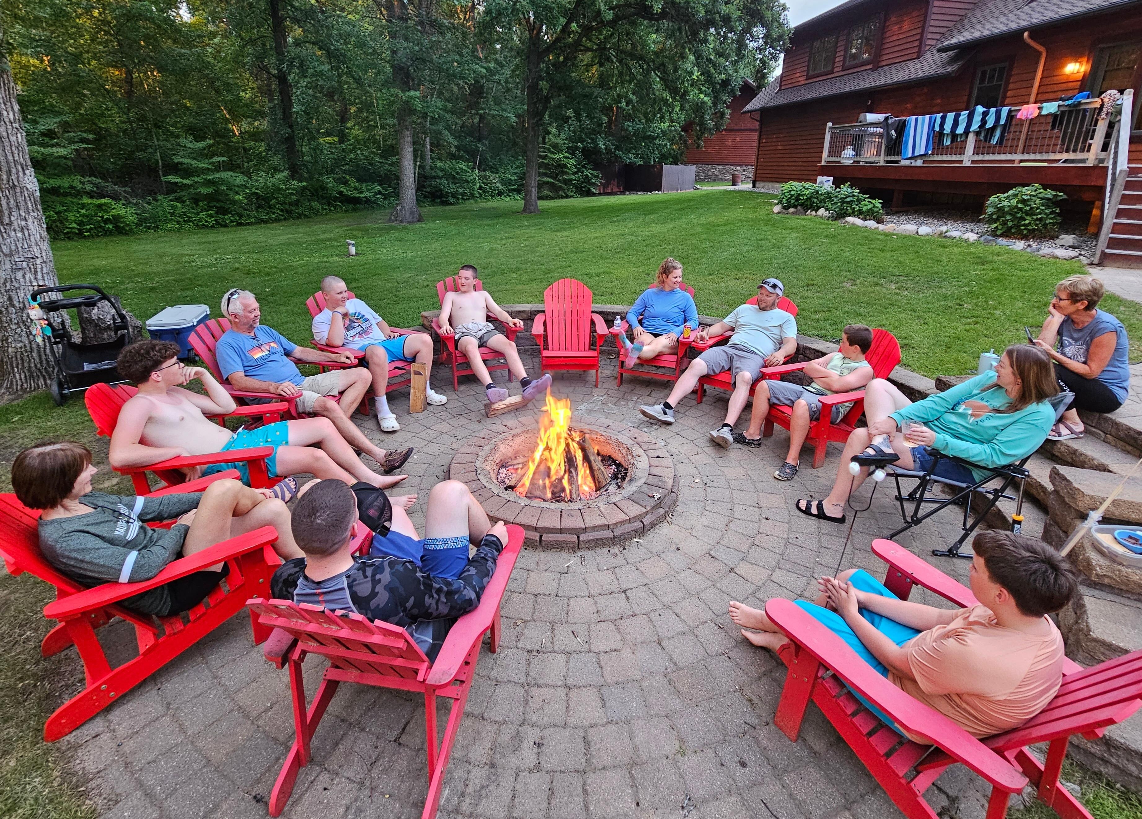 Plenty of seating for the campfire, including small child seats from the garage. Wood provided!