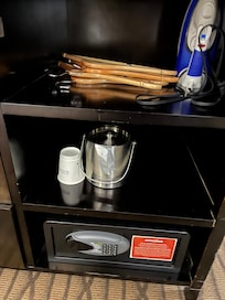 This is a closet at Wyndham Gardens - Westlake, OH. Some hangers but no place to hang them.