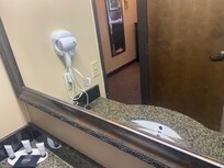 The mirror had not been cleaned, specs of dirt all over the mirror like it hasn't ween wiped down