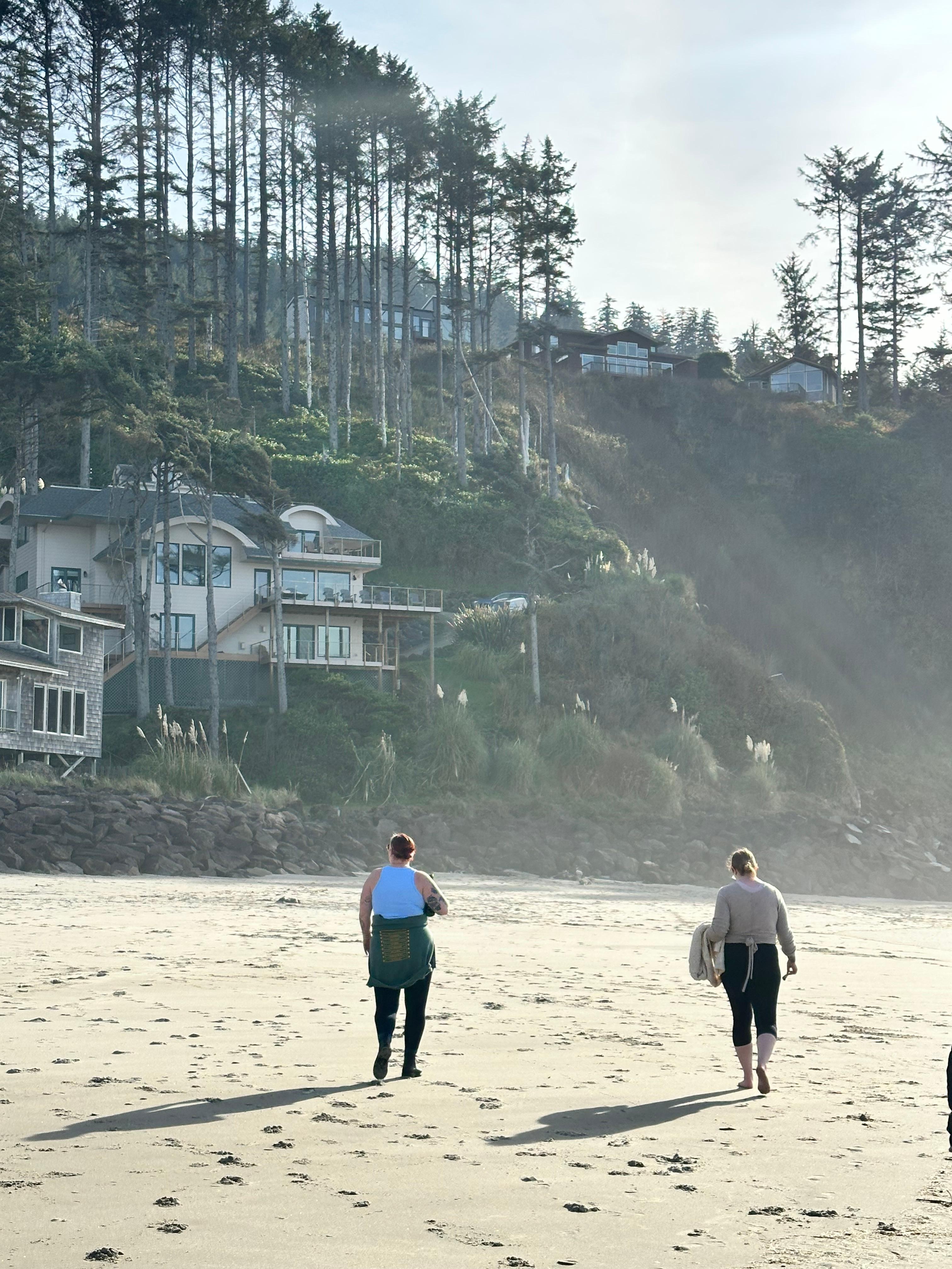 Walking on the beach back toward the house (the one hugging the cliff)