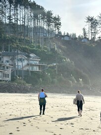 Walking on the beach back toward the house (the one hugging the cliff)