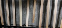 Broken frame slats in the double bed.
