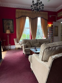 Main living room. Plenty of seating, brochures, fridge, microwave, coffee and tea.