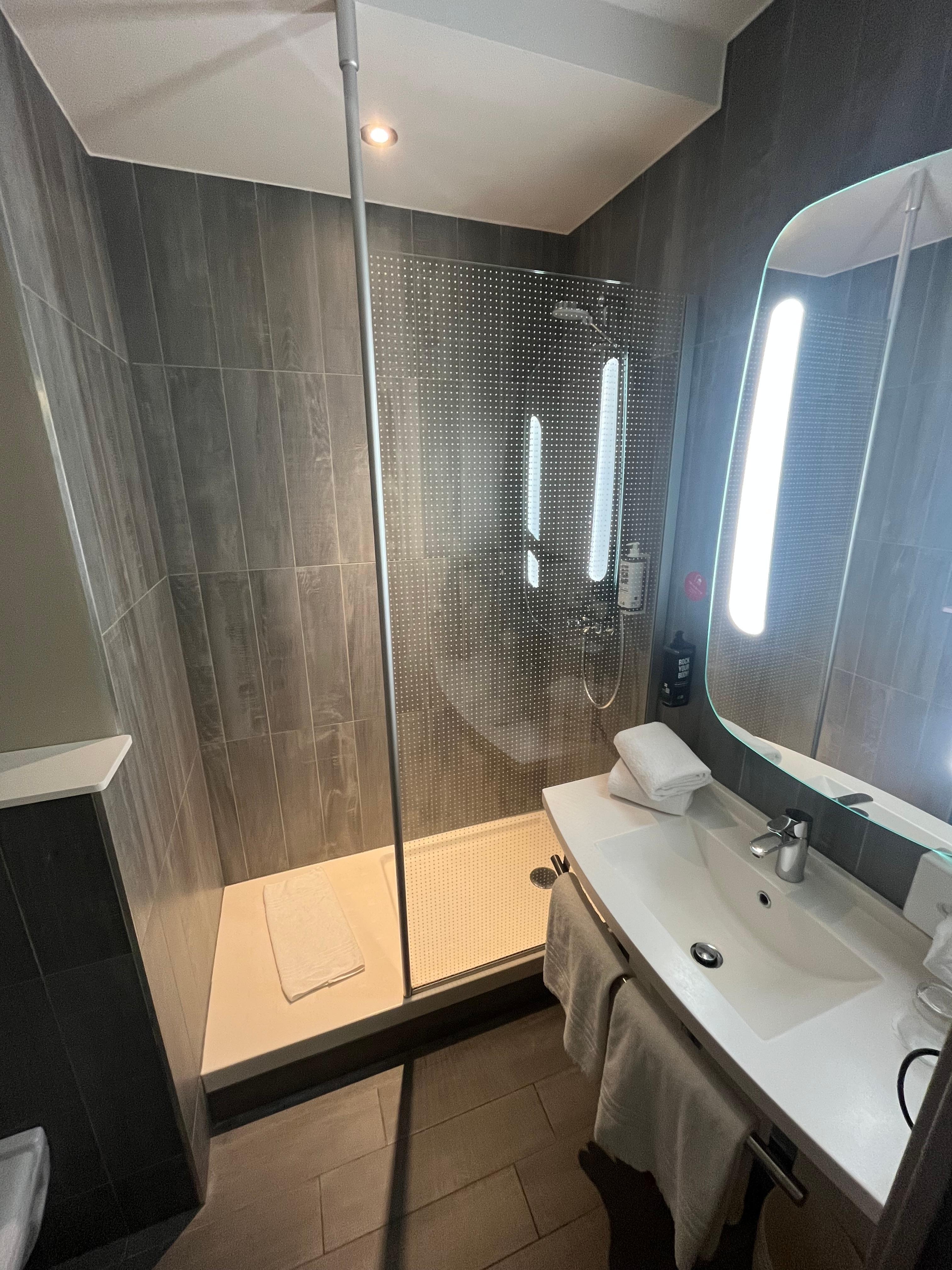 Restroom was clean & spacious. The shower has no door and gets really cold & slippery on that first landing spot. Additionally, if you’re tall like us (6’-6’4”) prepare for your knees to be up & on the wall when you use the toilet! Lol 