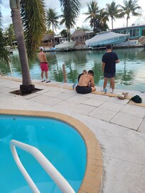The boys fishing in the canal.