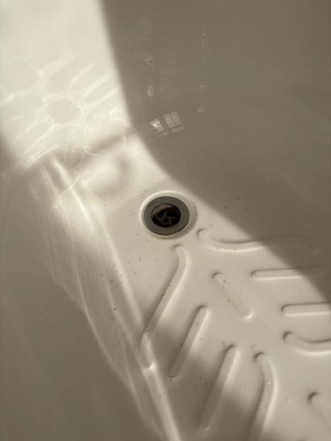 Dented bath from the shower dropping