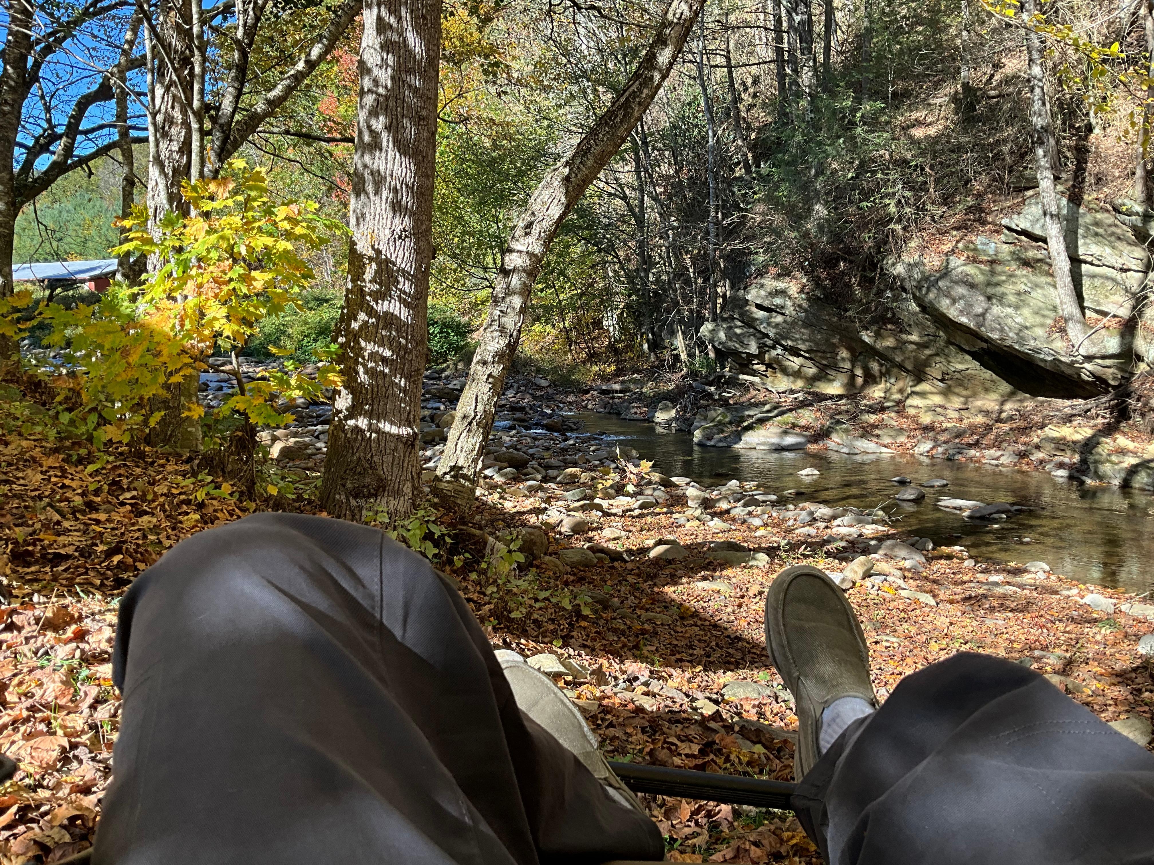 Relaxing by the creek next to the cabin. Favorite part of the day after hiking the local trails.