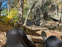 Relaxing by the creek next to the cabin. Favorite part of the day after hiking the local trails.